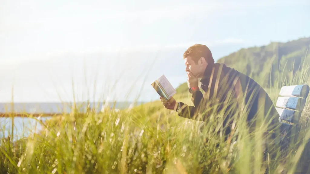 Man reading outside