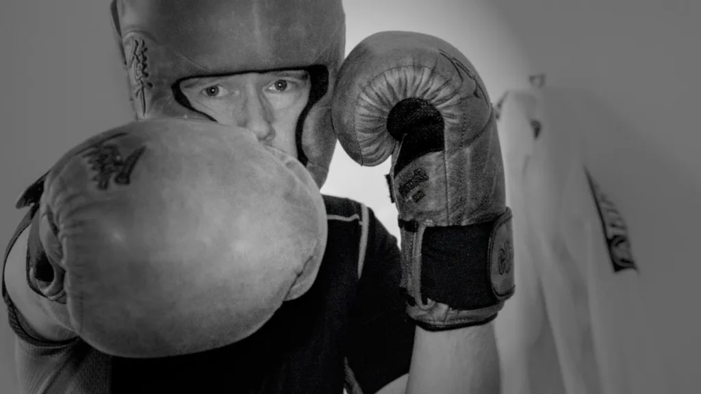 Man Throwing Punch with Boxing Gloves