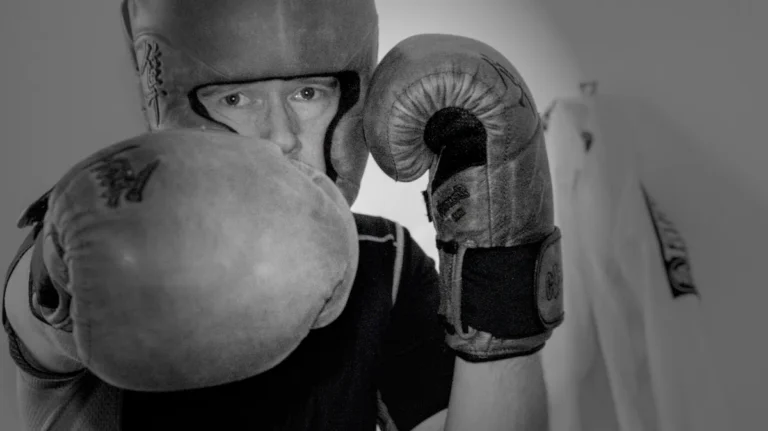 Man Throwing Punch with Boxing Gloves
