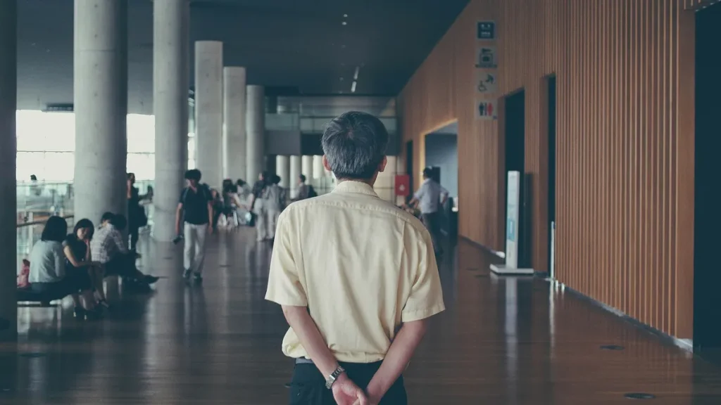 Man Walking Through School