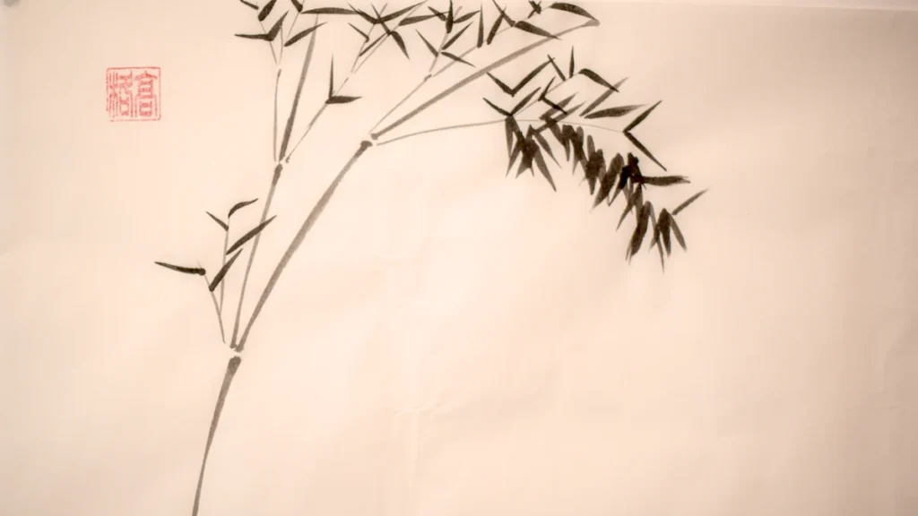 A stem of bamboo painted in ink with a red seal, most of the paper left white